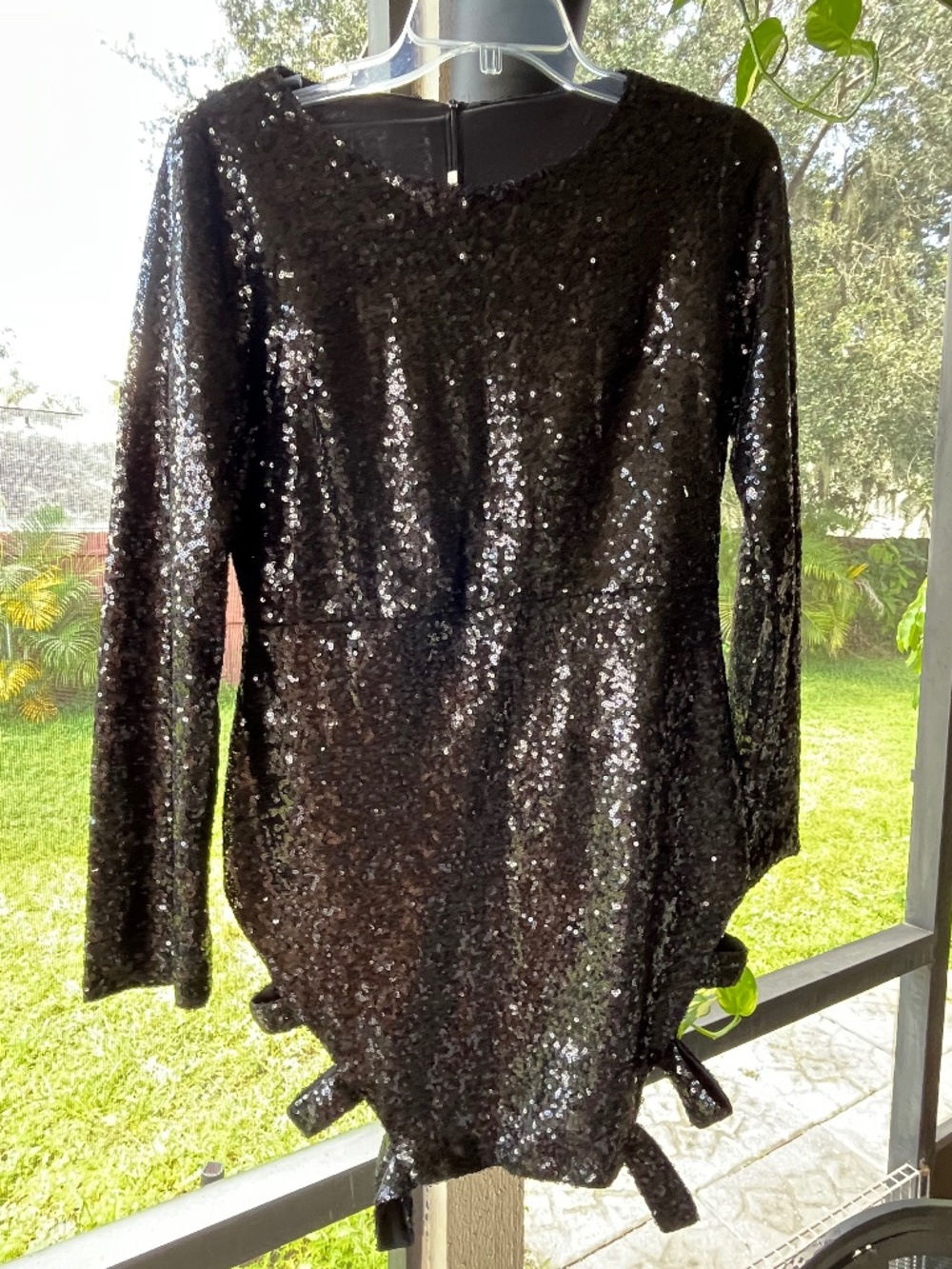 Black long-sleeve sequin mini dress side tie or cutout strap details